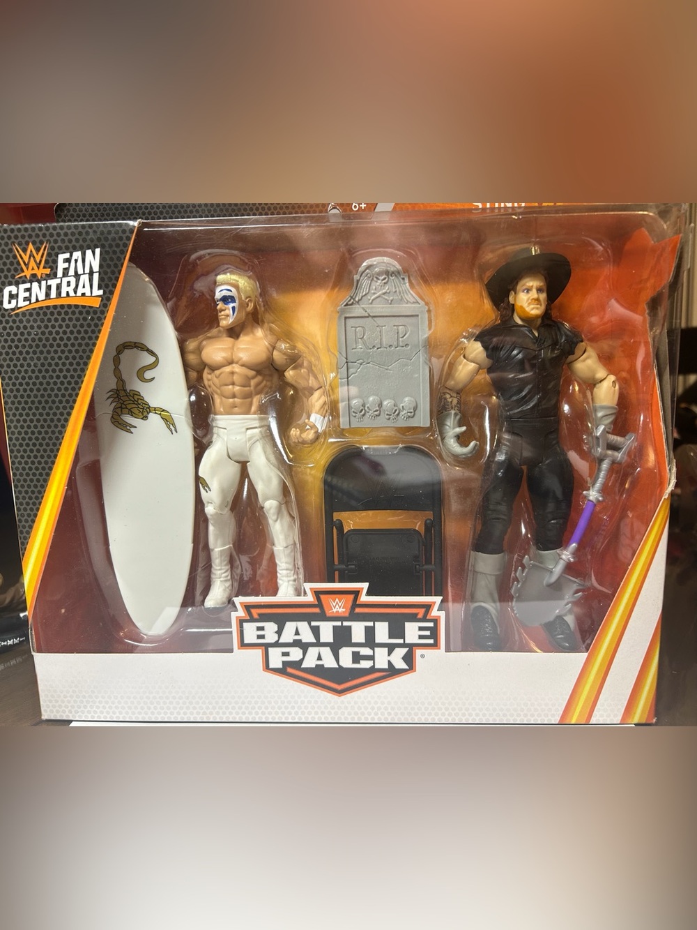 WWE Sting vs Undertaker Packaging Art in Orange, Black, White